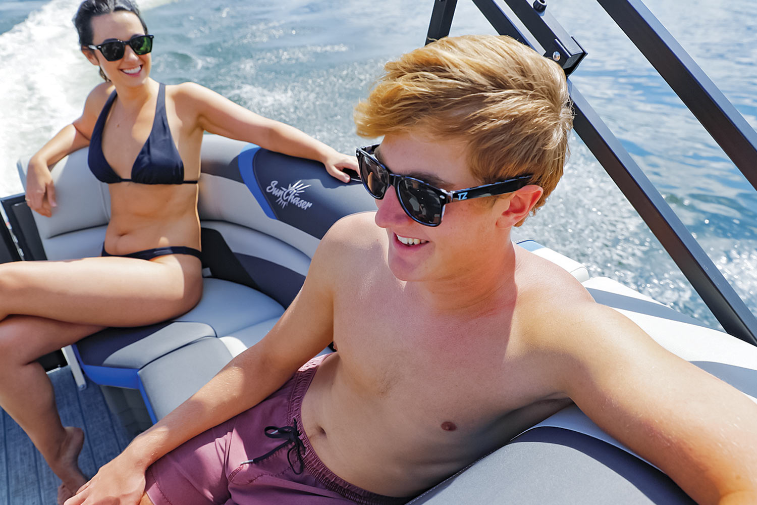 man and women sit in the back seats of the SunChaser Geneva 22 LR DH Sport