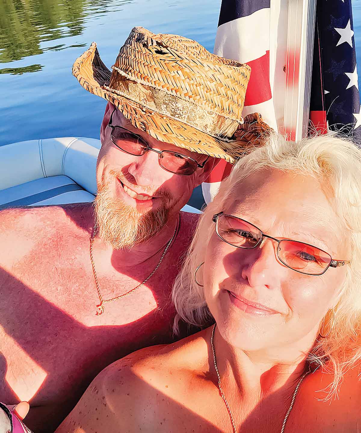 Tabatha and Donny Myers taking a selfie on their boat and enjoying the sun