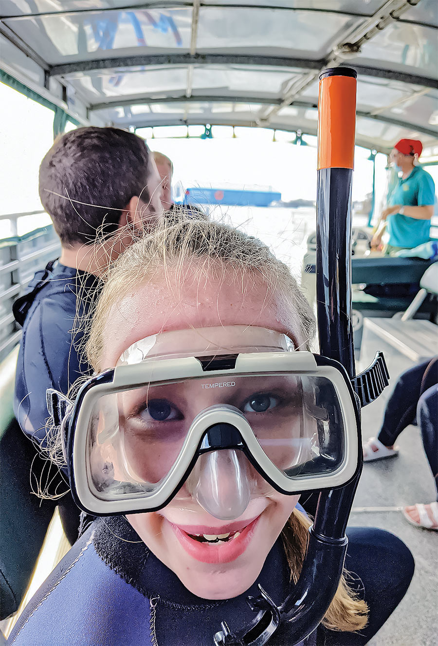 young girl with snorkel mask