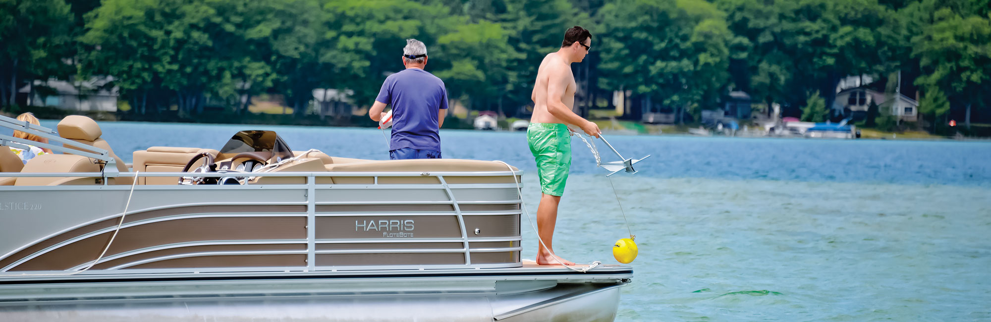 People on a Harris Pontoon dropping an anchor