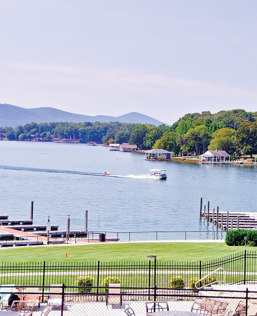 boat driving through water at Smith Mountain Lake