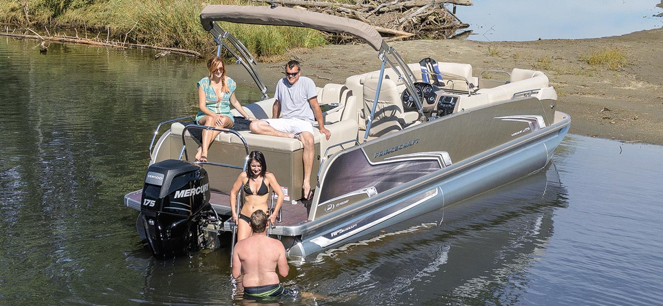 a group of four enjoys a pontoon on the water