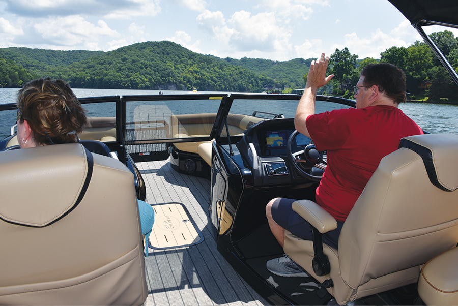 the Craigs waving at others in 2020 Amara pontoon