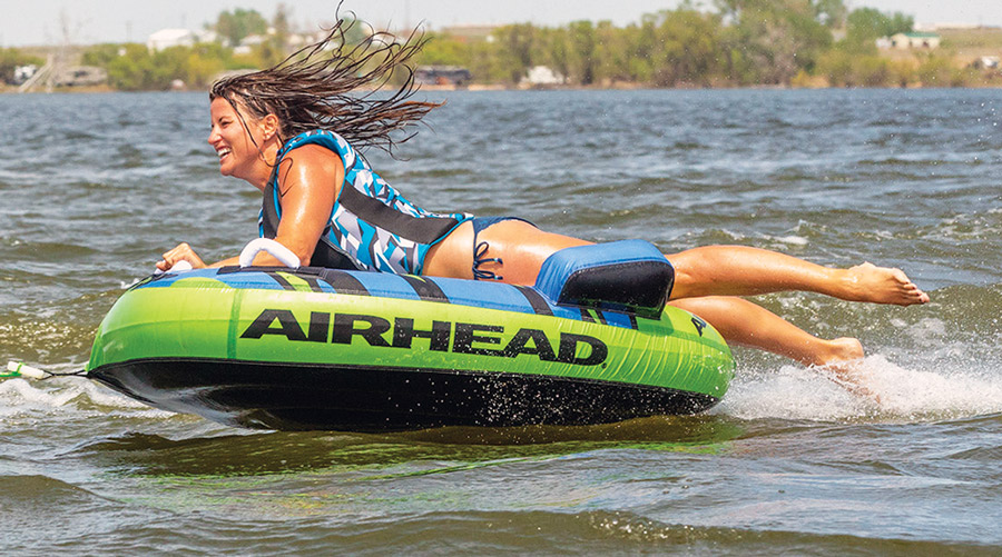 woman riding a Shield by Airhead raft