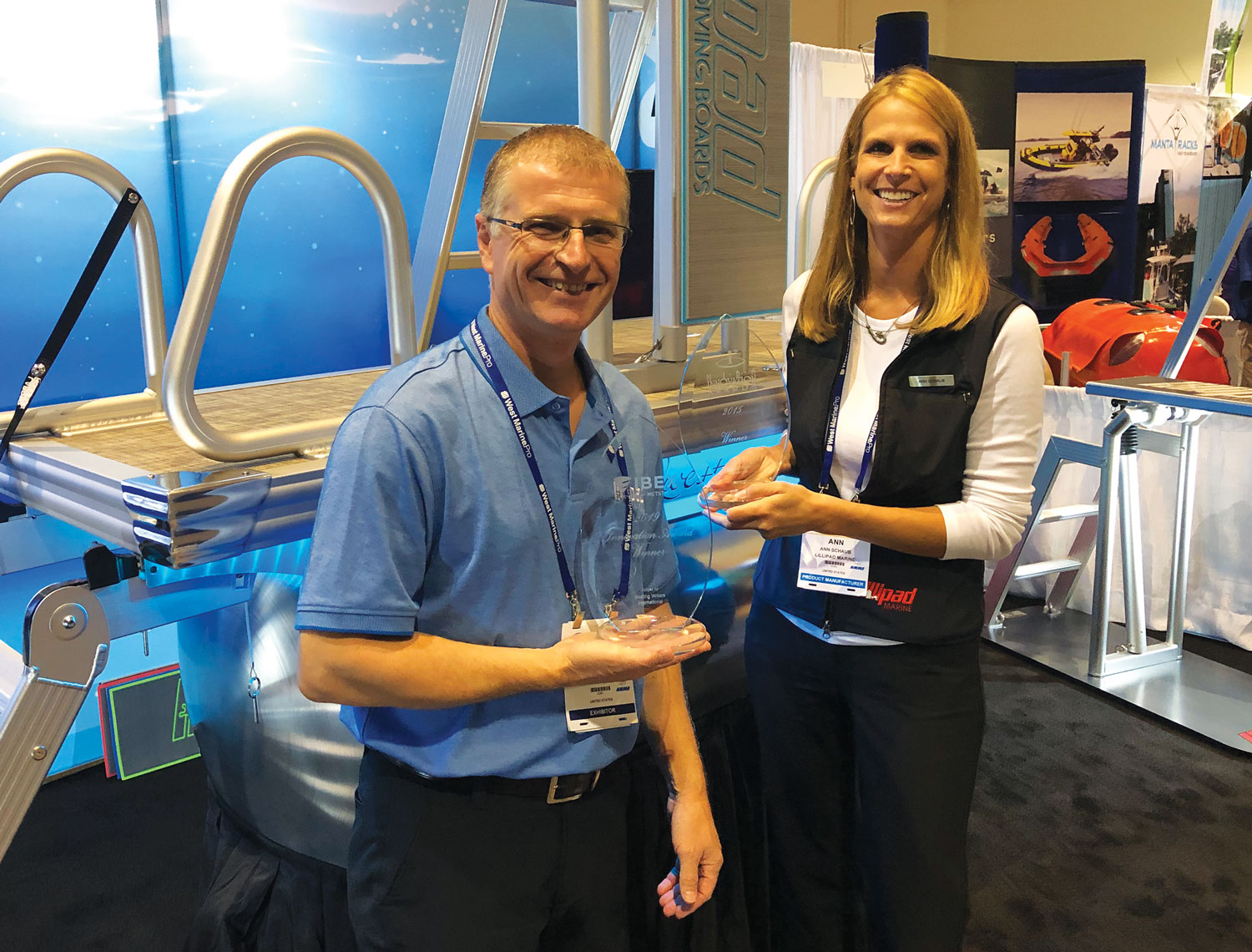 Corey Schaub (L) and his wife Ann proudly hold their NMMA Innovation Awards during the 2019 IBEX show