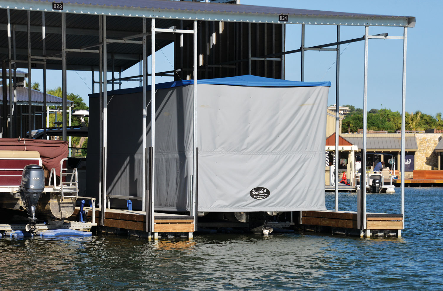 Pontoon on a lift with a cover