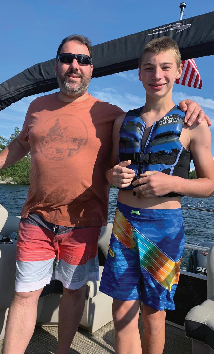Robert Layer and his son on their boat