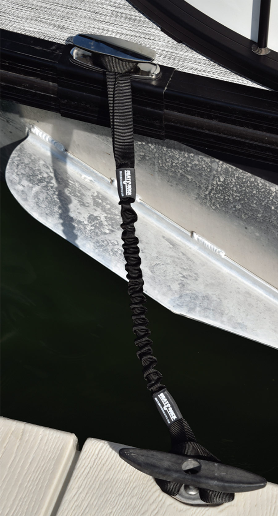 A close up view photograph of a Bungee Dock Line securely hooked from pontoon to dock