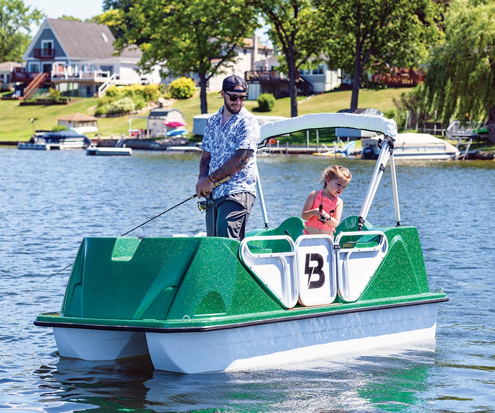 Man and child fishing on a Boka Marine E-Boat
