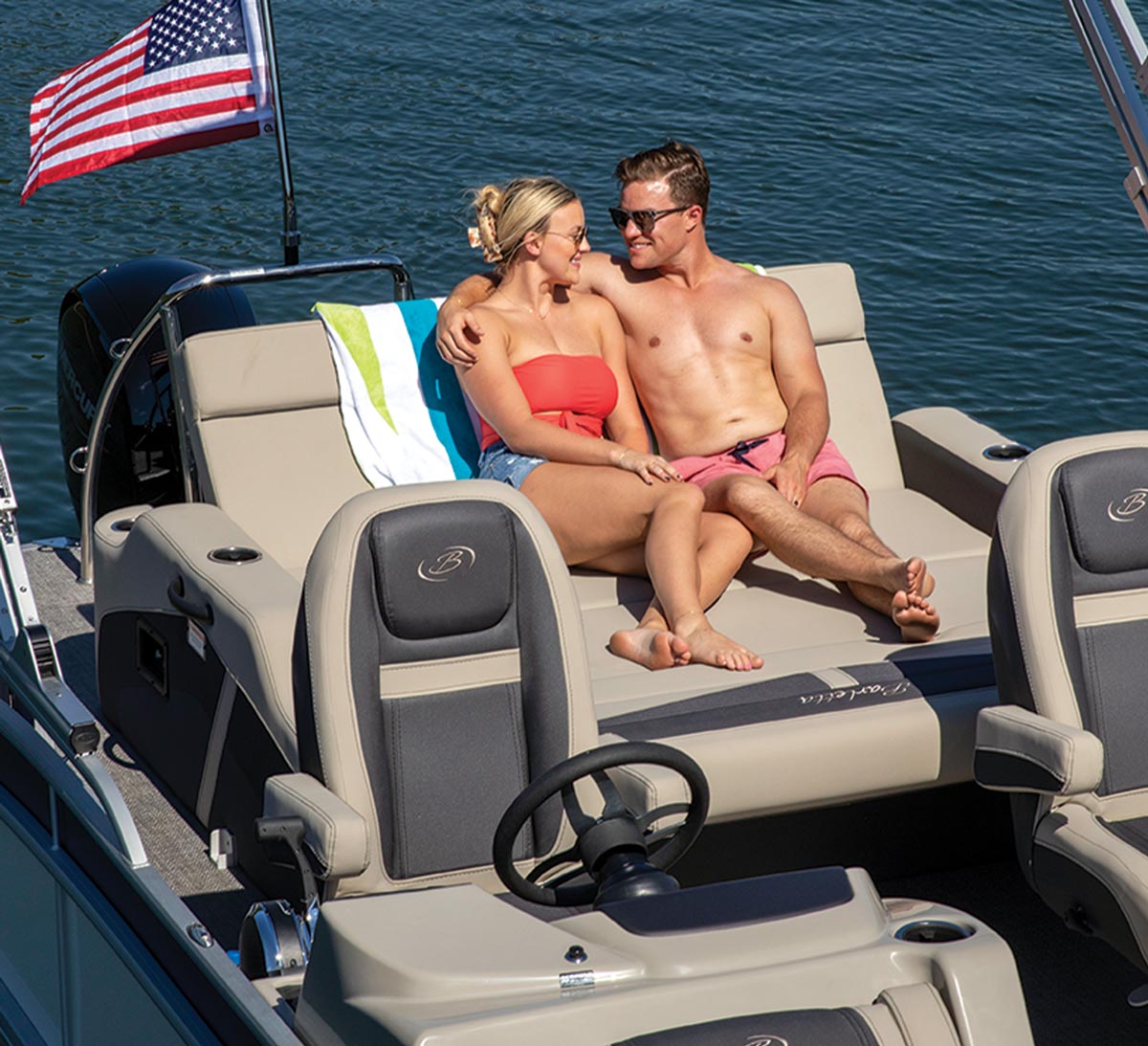 a couple relaxing on the Barletta Cabrio 22UC chaise lounge
