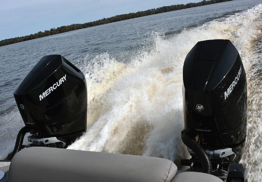 two black mercury engines on the back of a boat