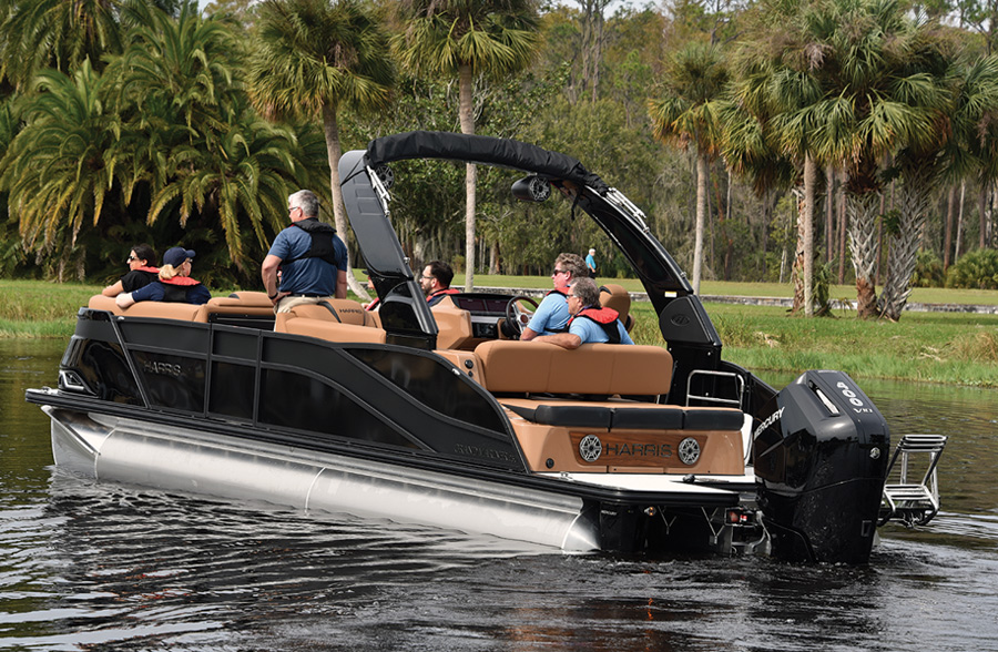 view of black boat with tan interior in still water