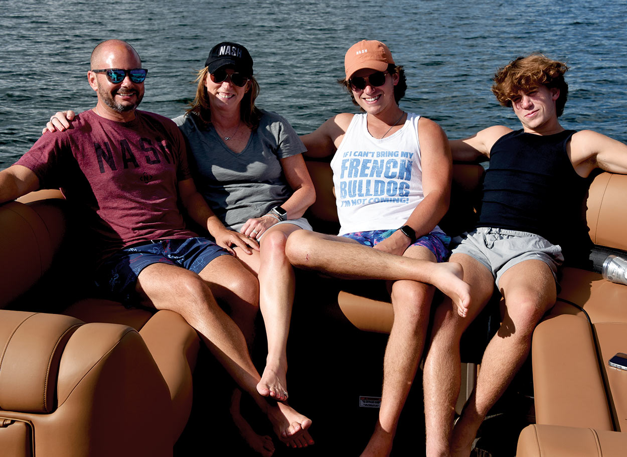 Bose family sitting on boat together