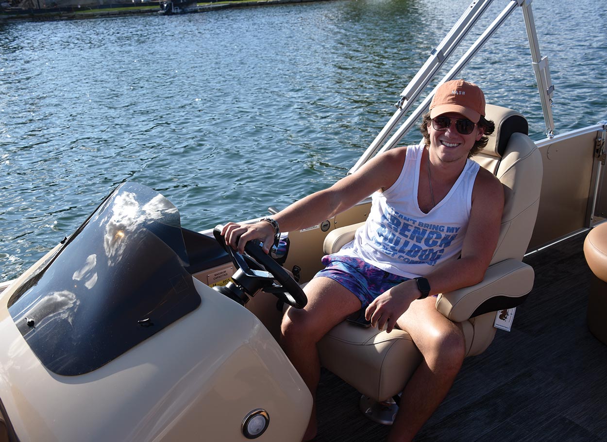 Son driving the boat