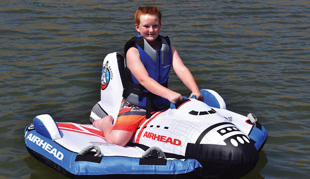 Little boy on Airhead Space Shuttle towable