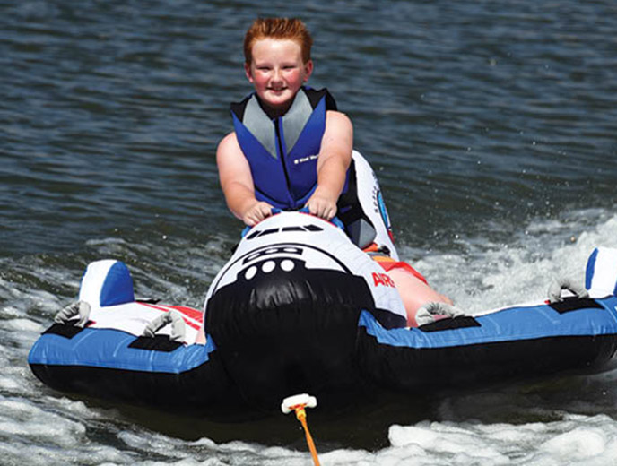 Little boy on Airhead Space Shuttle towable