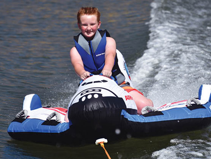 Little boy on Airhead Space Shuttle towable