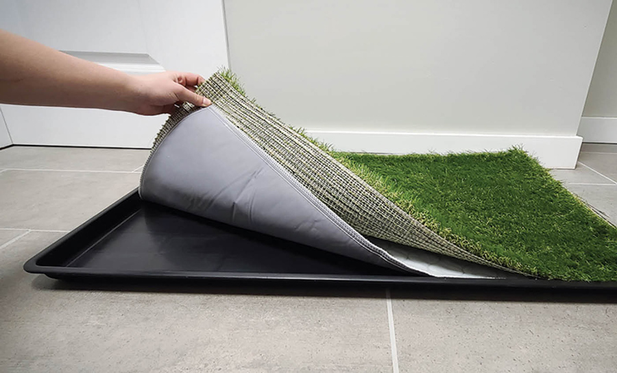 Large Dog Grass Potty Patch being lifted off the tray