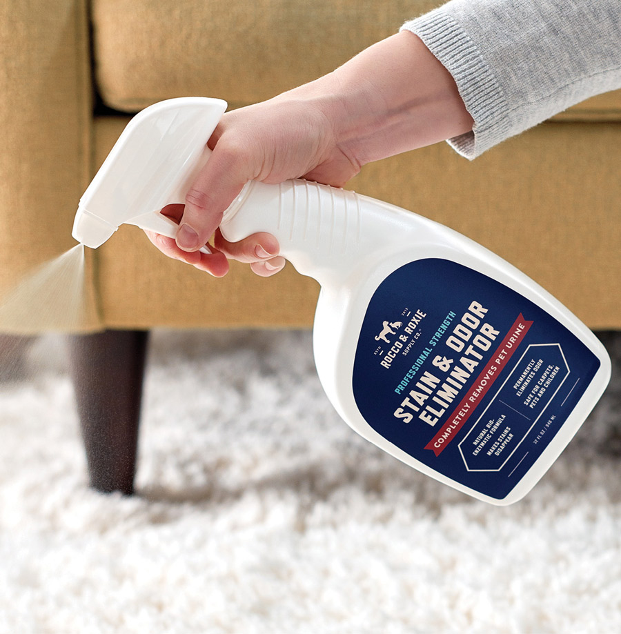 hand spraying Stain & Odor Remover