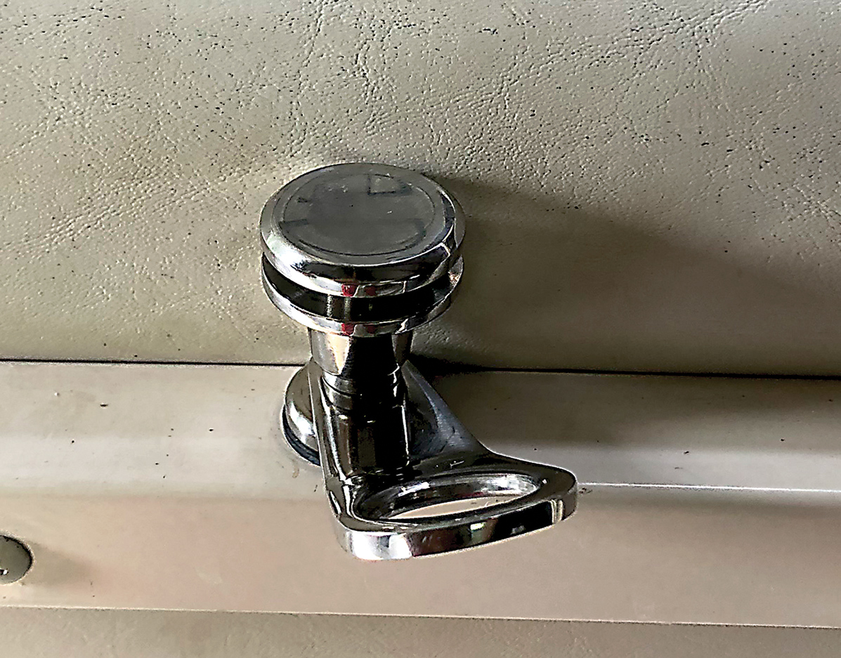Close-up view of an installed fender lock at the fence rail center area site of the Starcraft Marine Classic 180 boat
