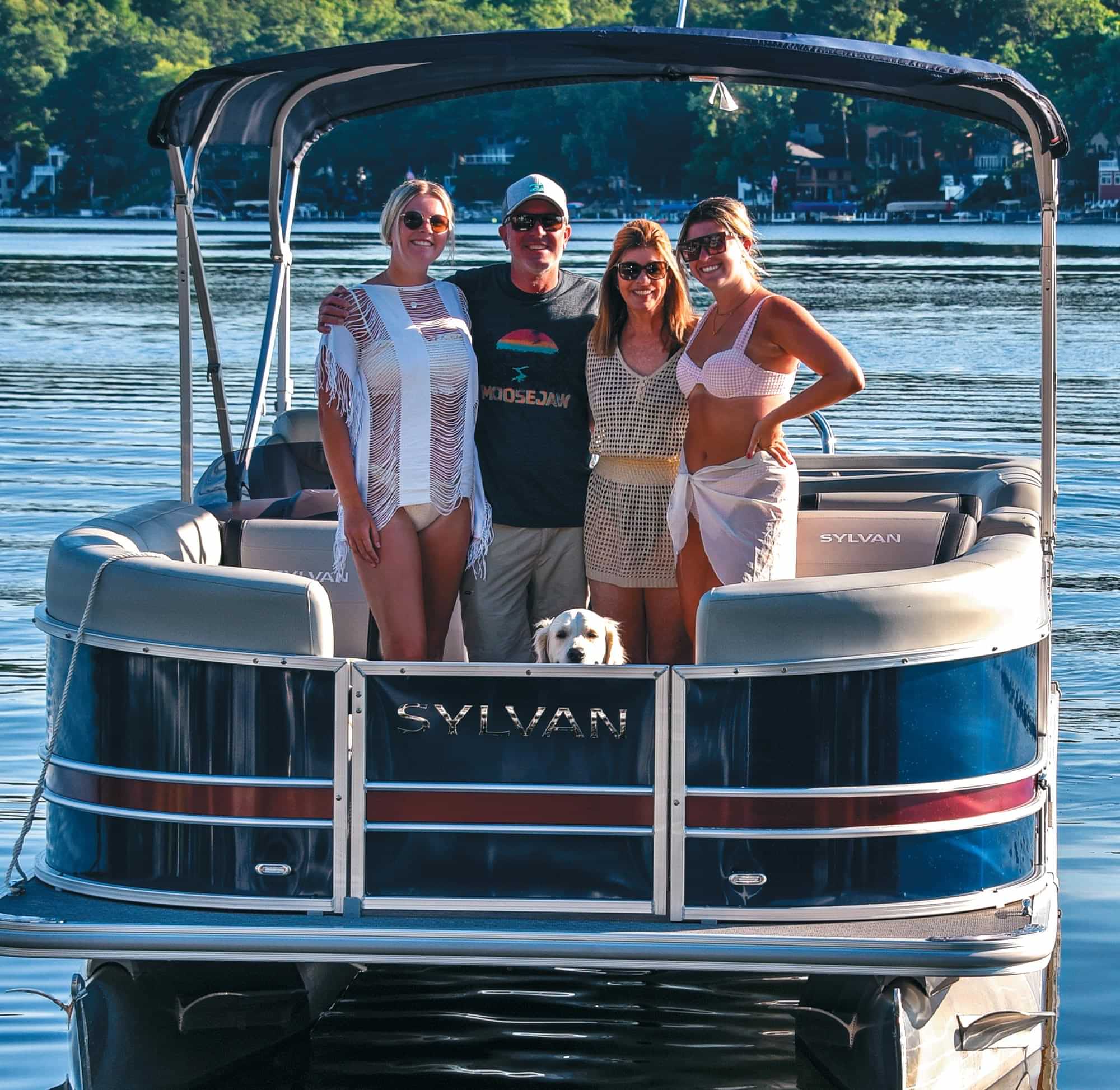 The Crowe family stand together for a photo on their Sylvan pontoon