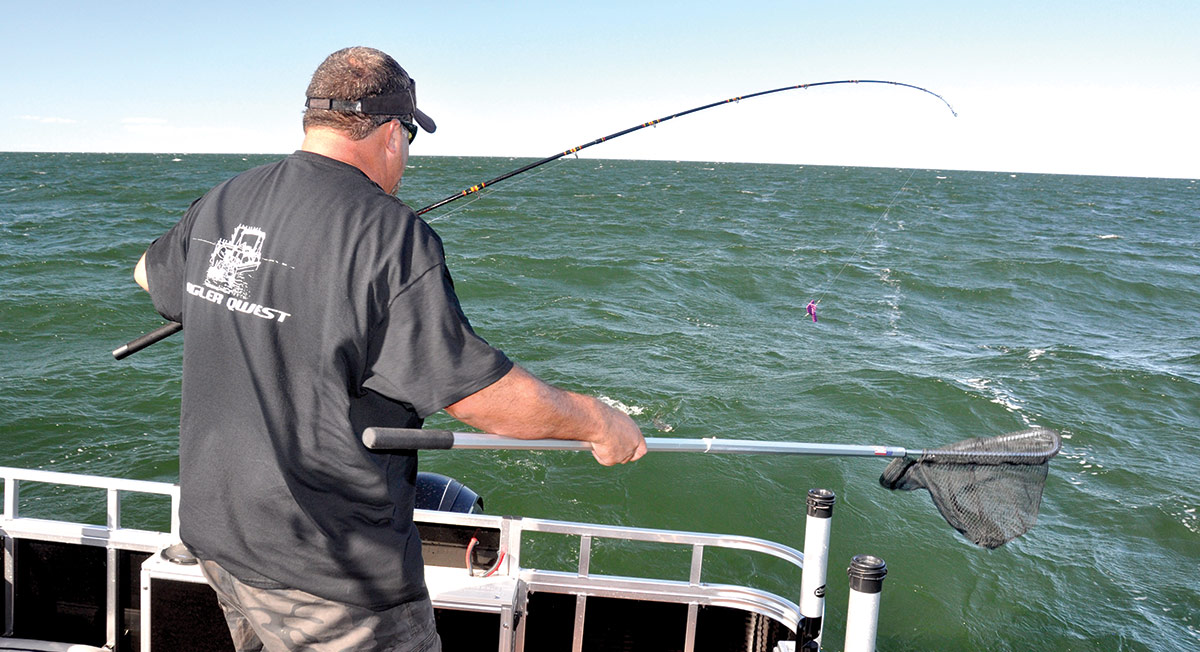 man with fishing rod and fishing net