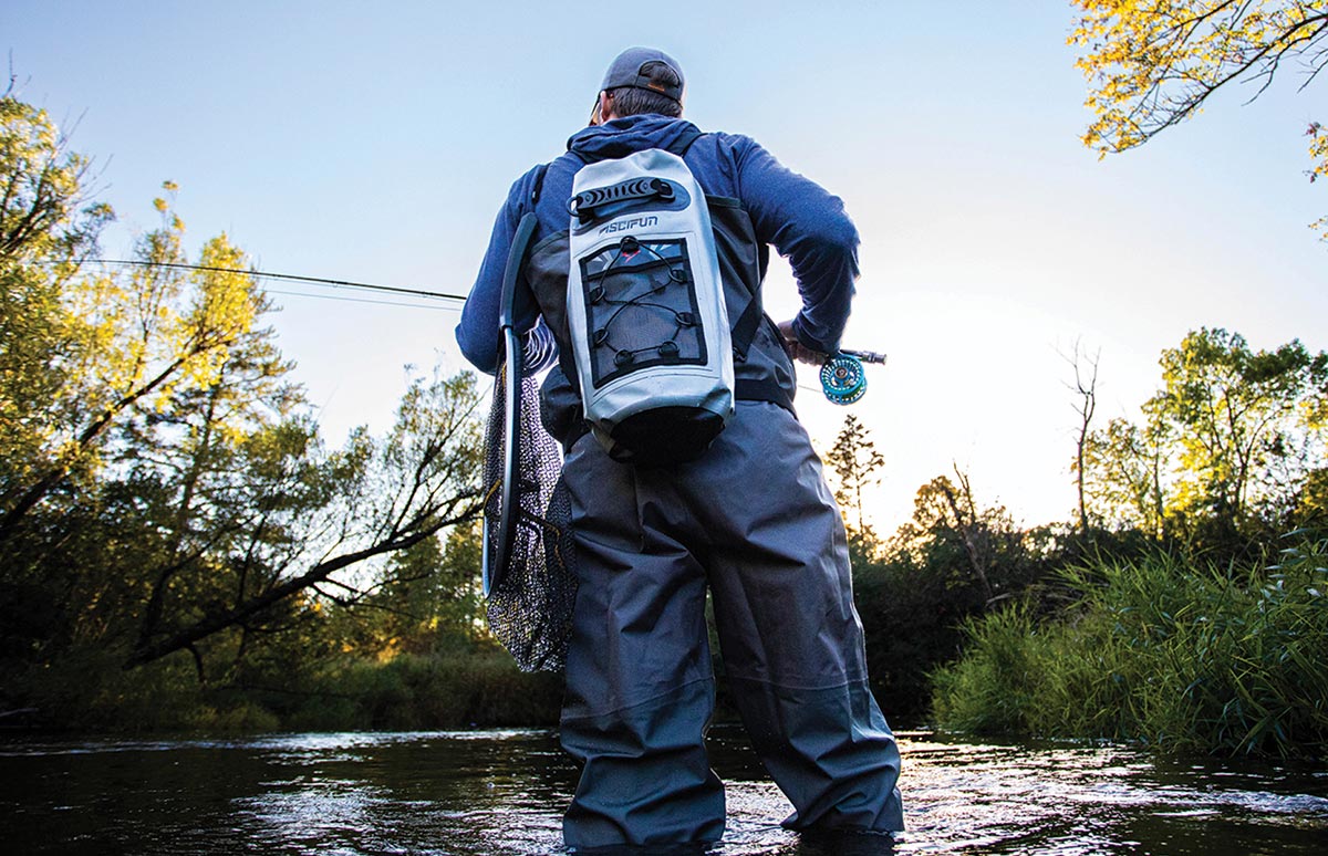 Fisher in water wearing Piscifun Waterproof dry bag