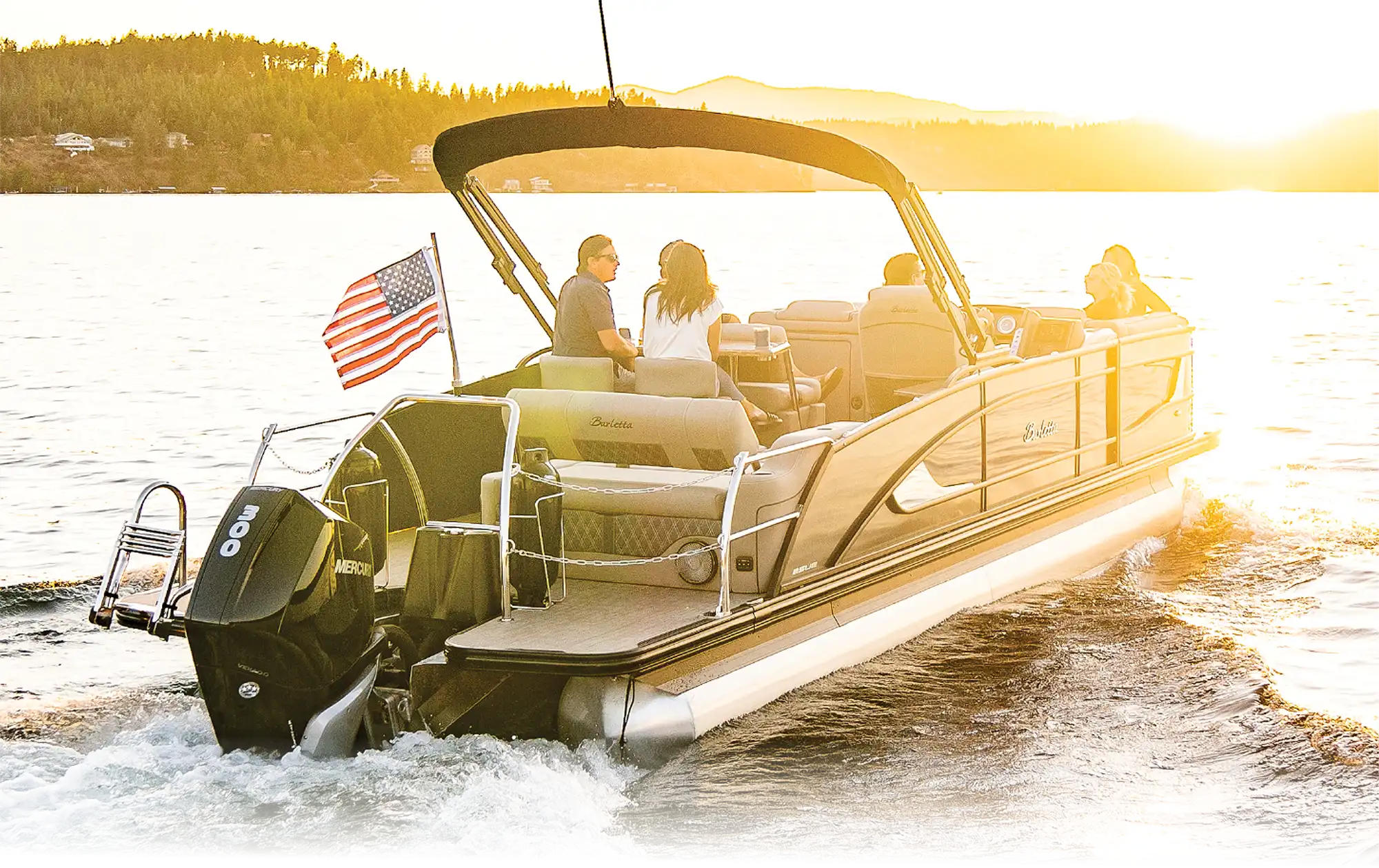 family on a boat with an American flag