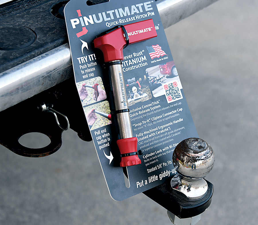 Close-up photograph perspective of the new all-titanium PinUltimate Quick-Release Hitch Pin situated on top of a tow hitch