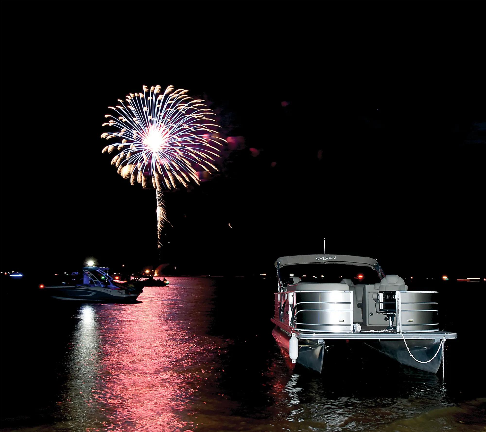 Boats on the water watching fireworks