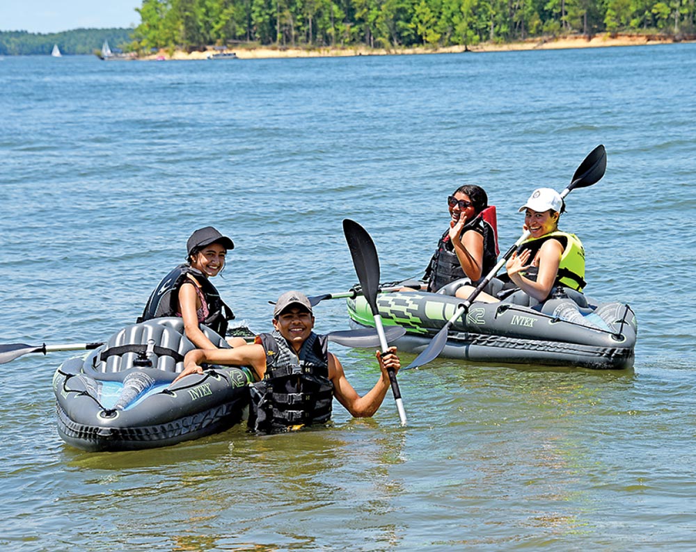 Family in inflatable kayaks
