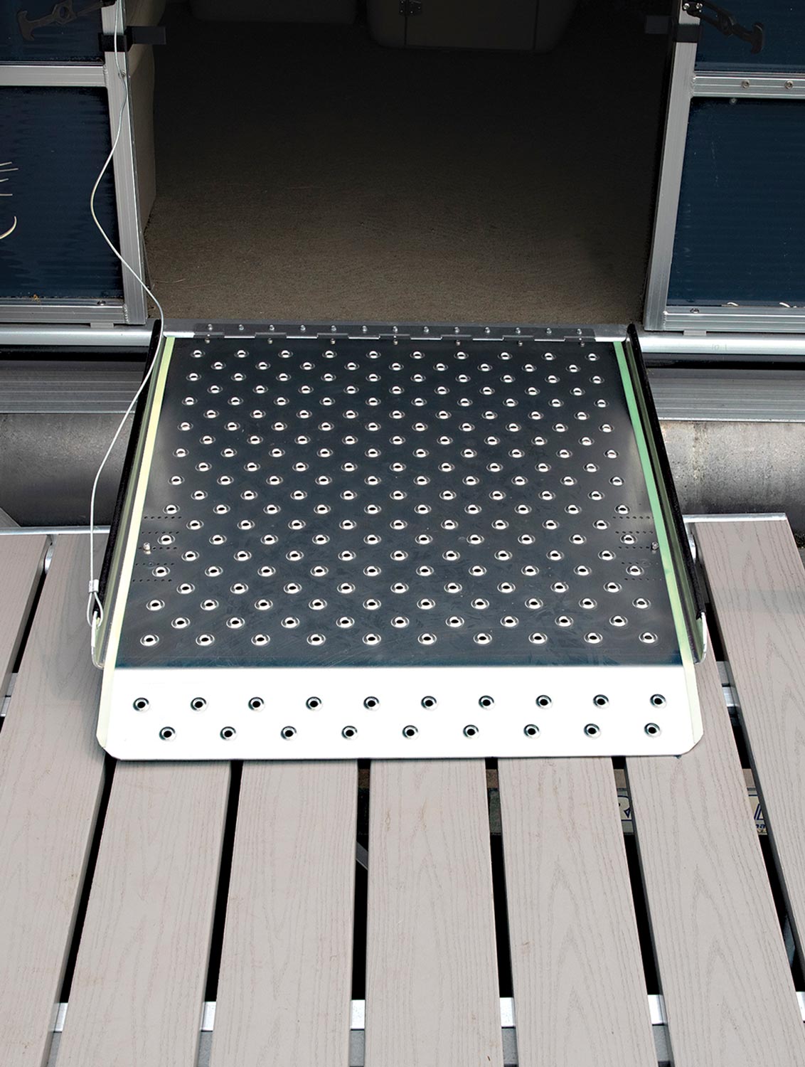 the Harbor Mate Pontoon Side Ramp attached to a pontoon