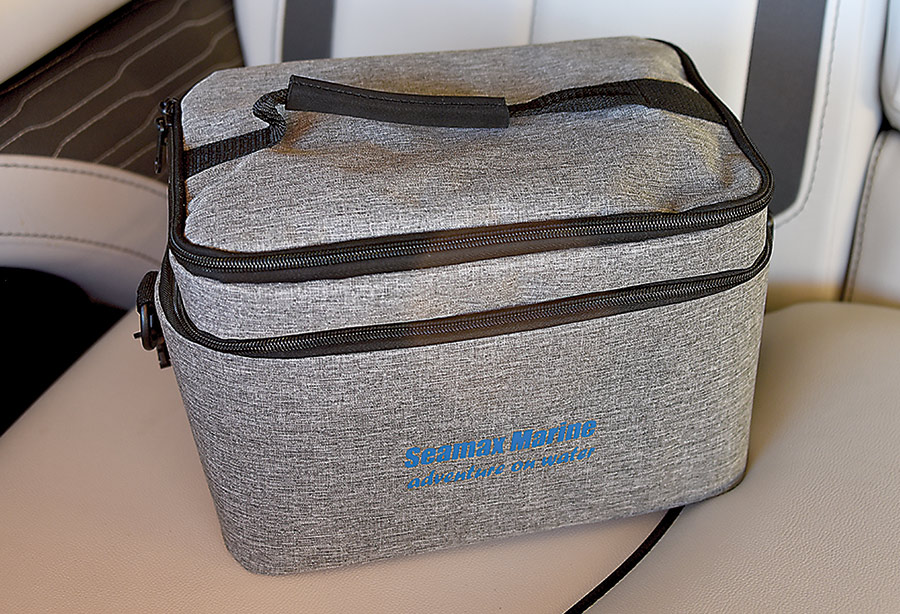 Close-up photograph perspective of the closed grey colored carrying case travel bag for the Seamax Marine SUP16DB Electric Air Pump with the Seamax Marine blue colored typographic logo proudly on display cemented onto the bag
