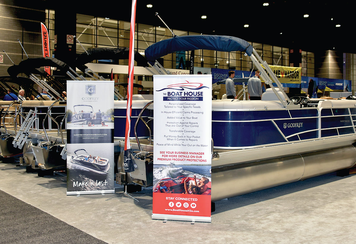 boat show banners near boats on display in show room
