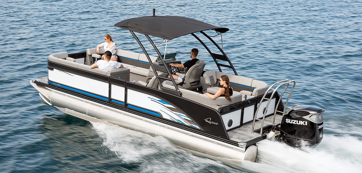 Two men and two women riding a white, blue, and black colored Qwest pontoon