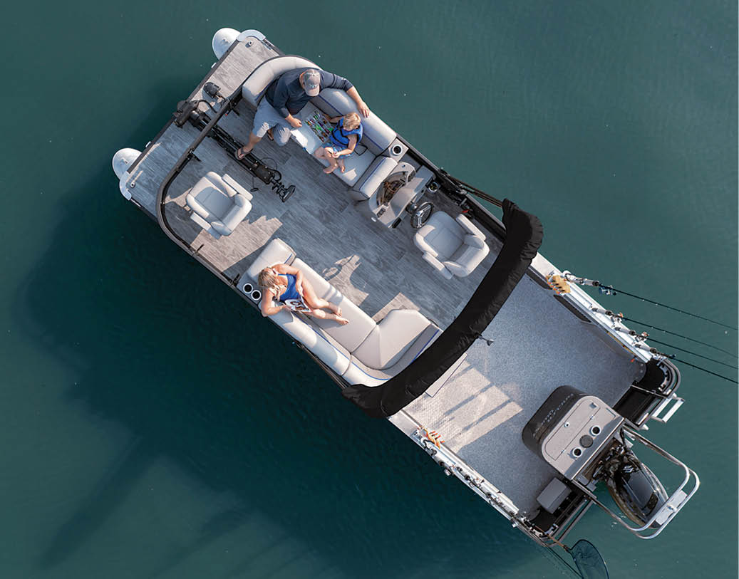 aerial view of a couple sunbathing on their pontoon