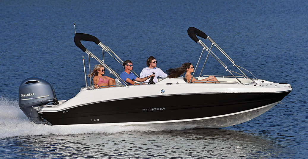 group of friends enjoy pontoon on the water