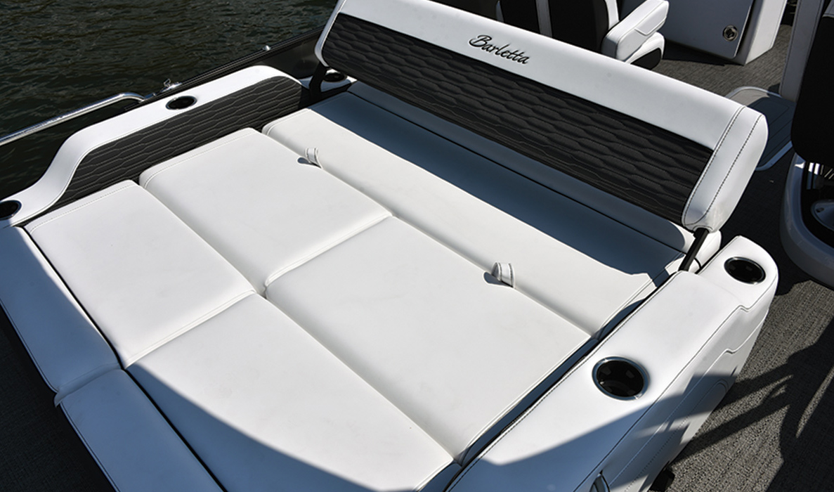 Close up of gray and white bench seats on the Corsa pontoon