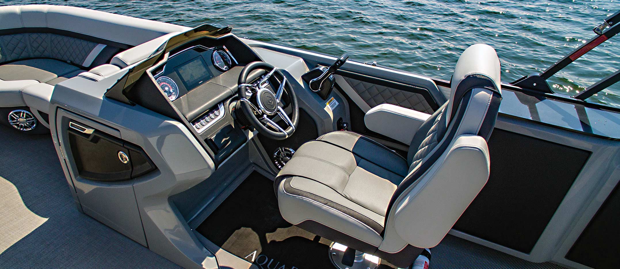 Close up of gray and white driver seat and steering column