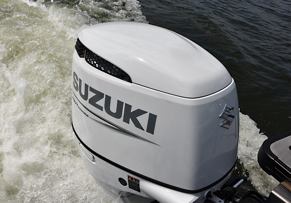 Close up of white Suzuki motor in the water