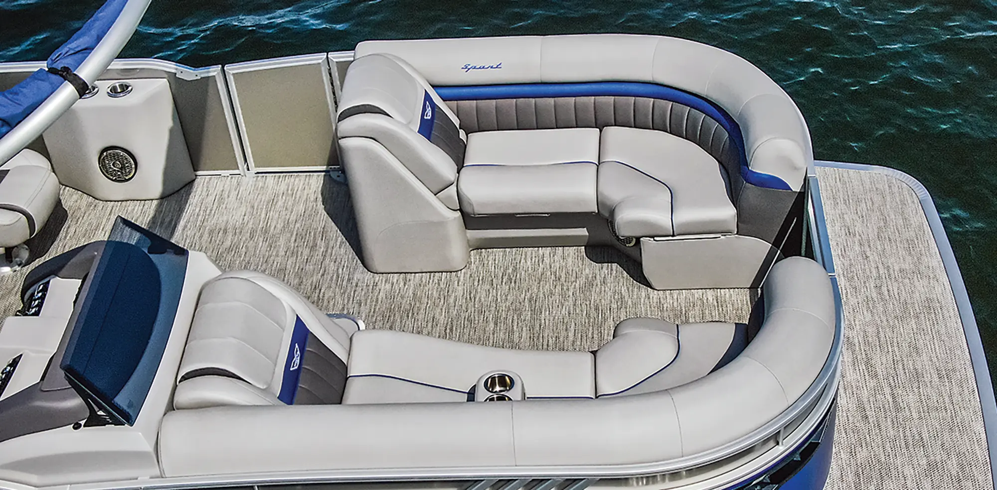 Aerial photograph view of the interior lounge couches area and driver's side area of the Bennington Sport 24 LXSSBA pontoon motorboat vehicle