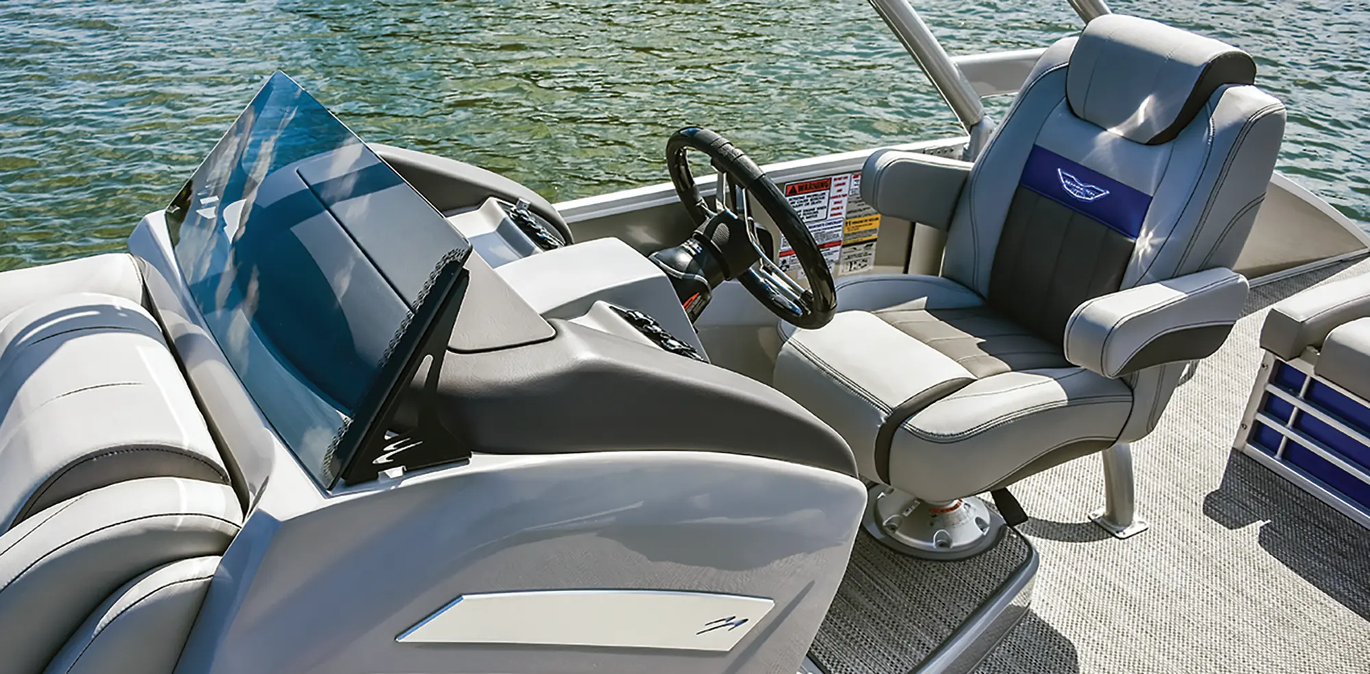 Aerial photograph angle view of the driver's side area of the Bennington Sport 24 LXSSBA pontoon motorboat vehicle