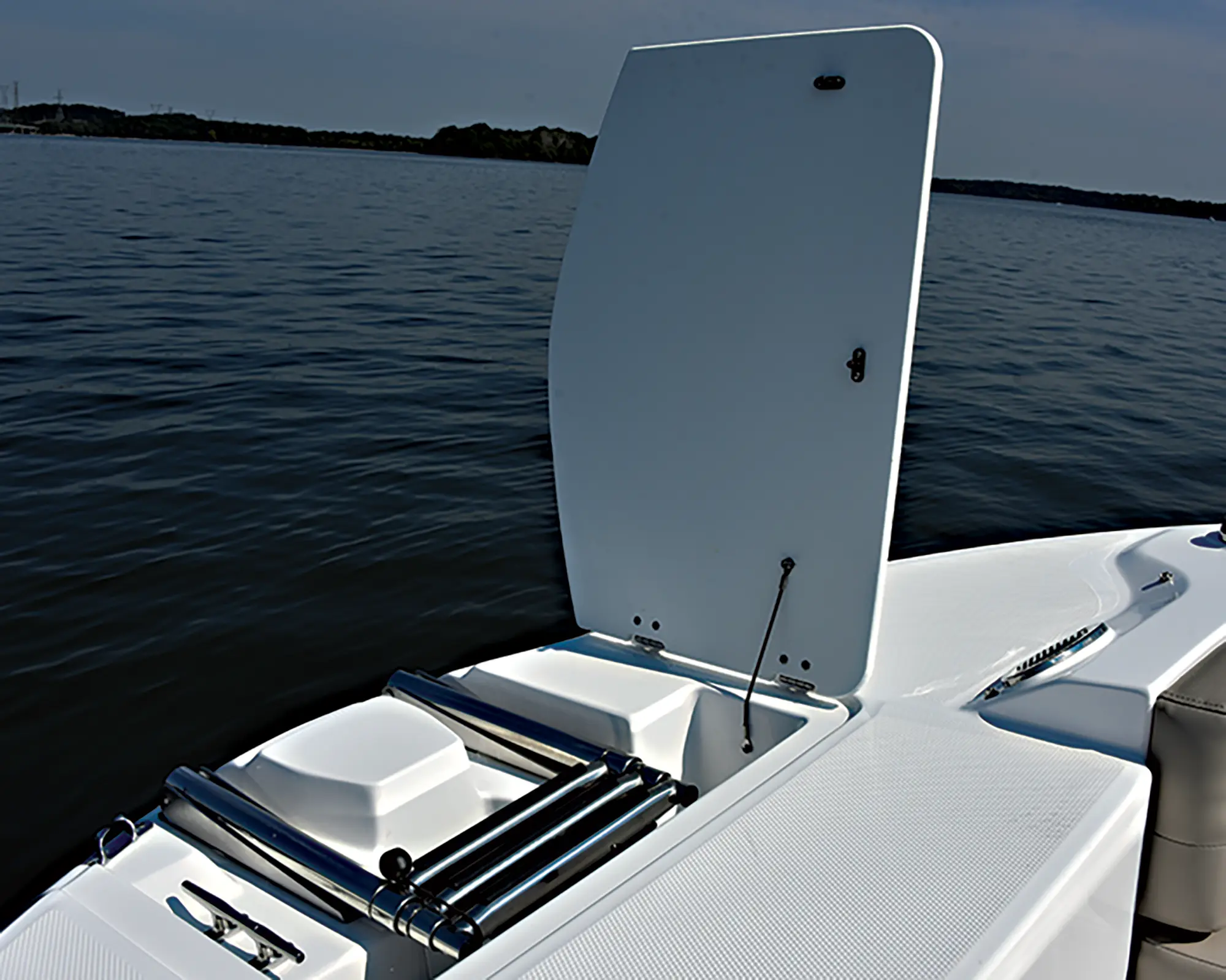 Aerial interior angle photo view of a storage space area with a door flap open in the air of the Hurricane SunDeck 235 pontoon motorboat vehicle