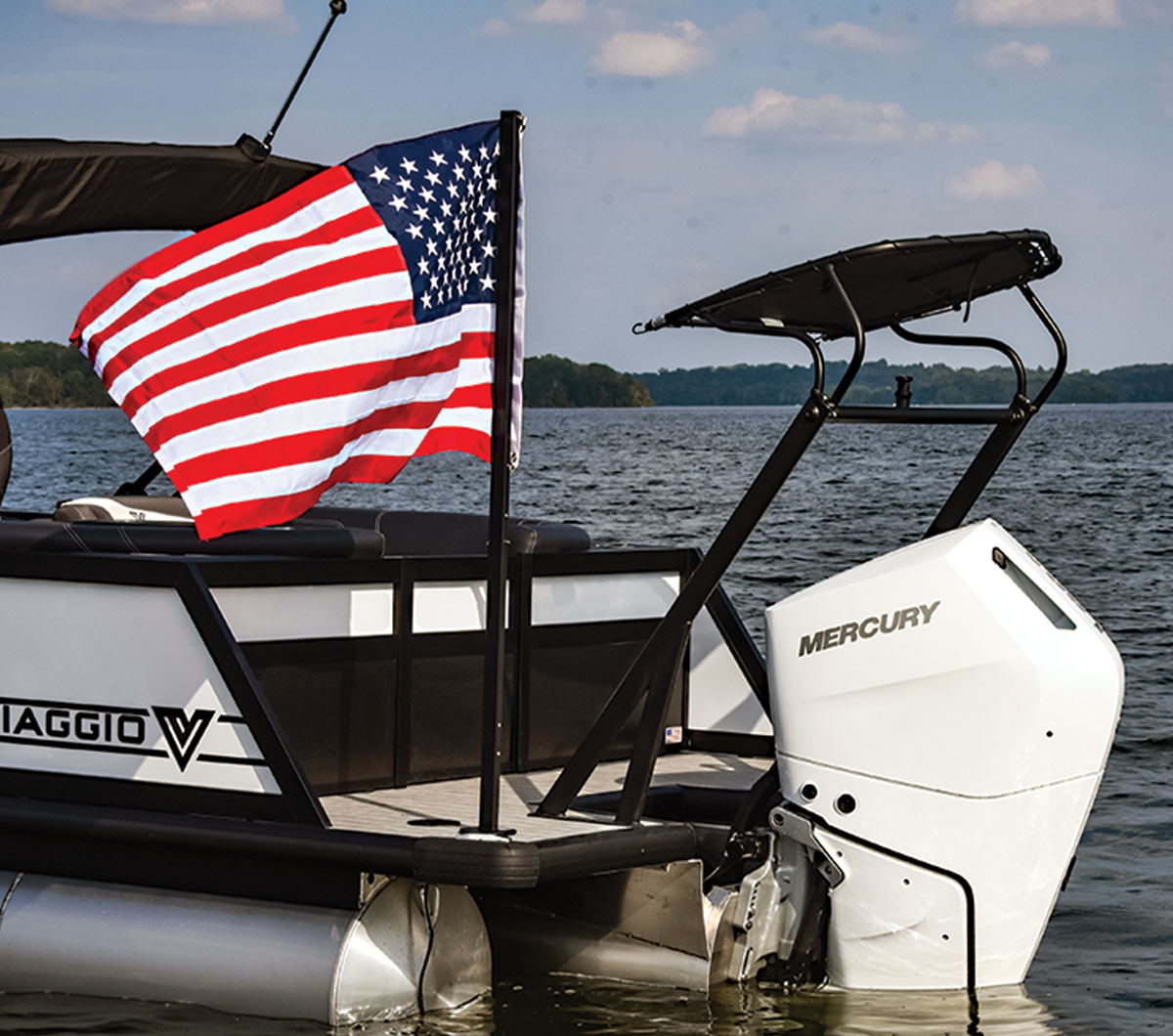 side view of the Viaggio Diamante's stern and the white Mercury Verado 400XL outboard engine