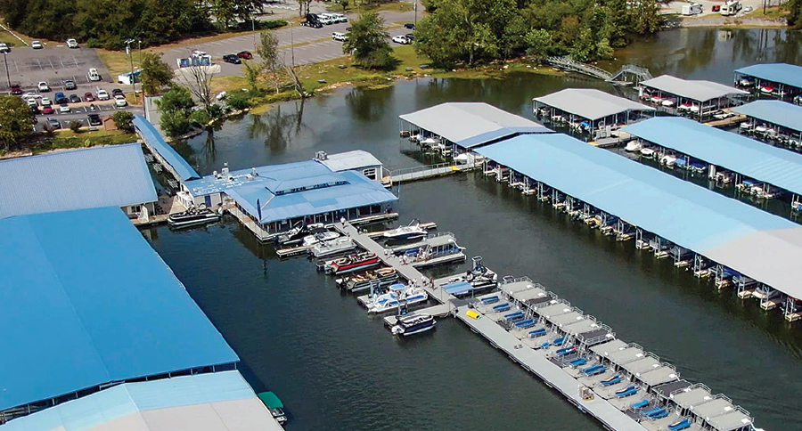 aerial view of docks with boats and roof covers