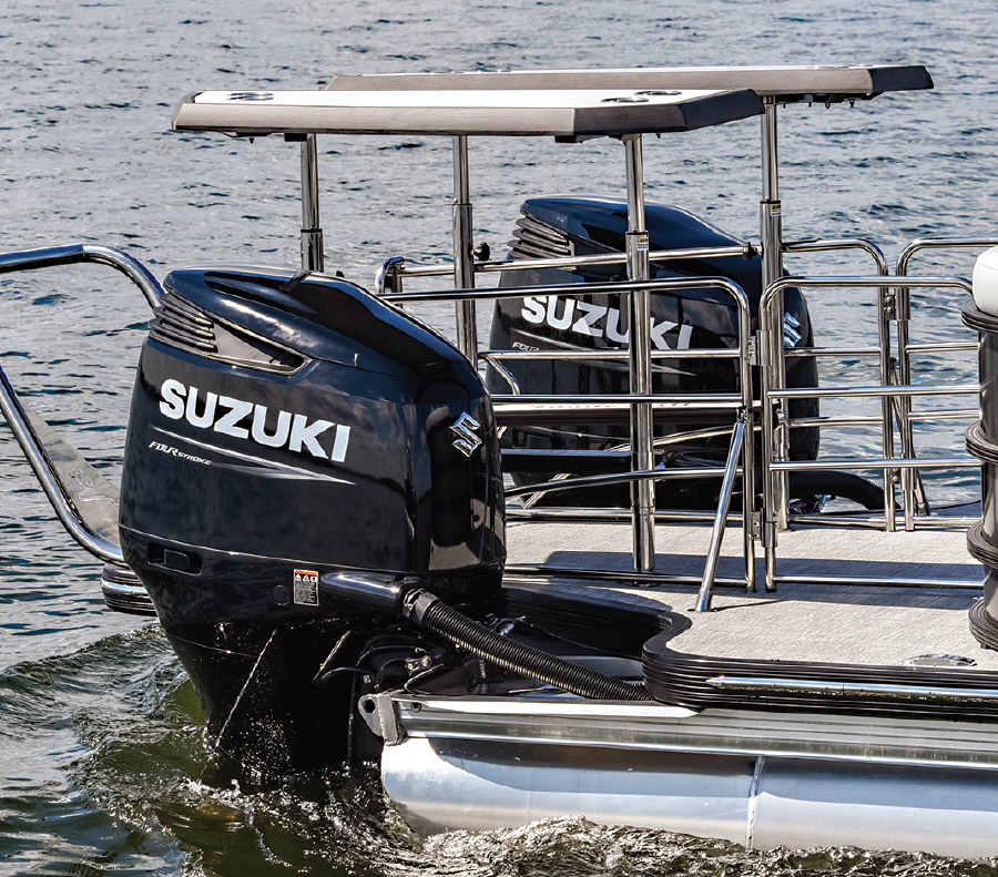 side profile view of Suzuki engines on rear of boat