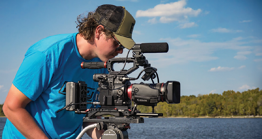 Michael Frisk operating camera near water