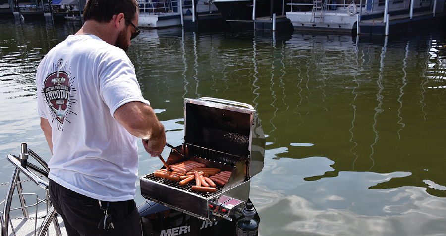 Chef Brian Grupp grilling hot dogs