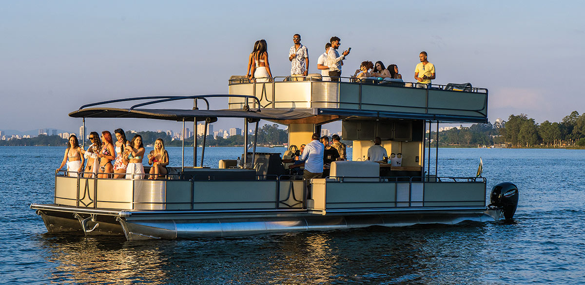 Double decker pontoon on the water, groups of people on both levels