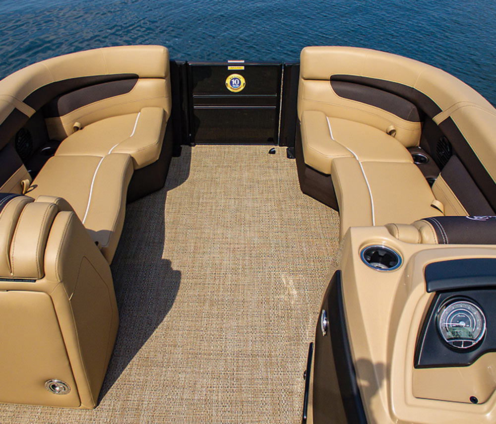 Landscape close-up photograph view of the Barletta Cabrio C22UC pontoon motorboat vehicle's passenger lounge couches seating area with cupholders equipped